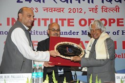 21. Minister along with CM NIOS Presenting the momento